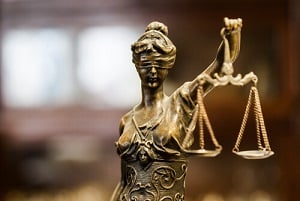statue of blind justice presiding over wrongful death case