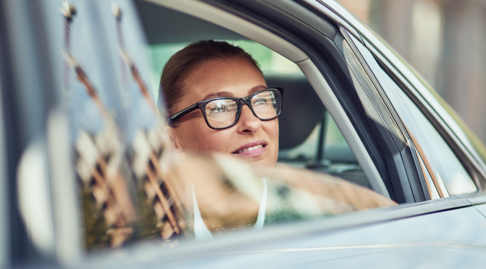 Uber passenger looking out the car window