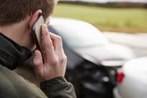 Man Calling To Report Car Accident On Country Road