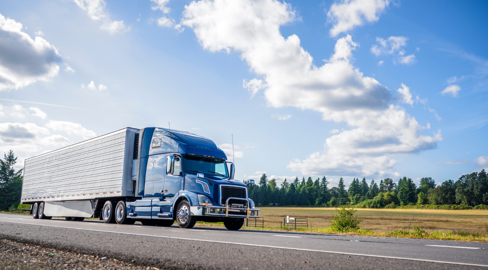 An 18-wheeler truck driving on the highway